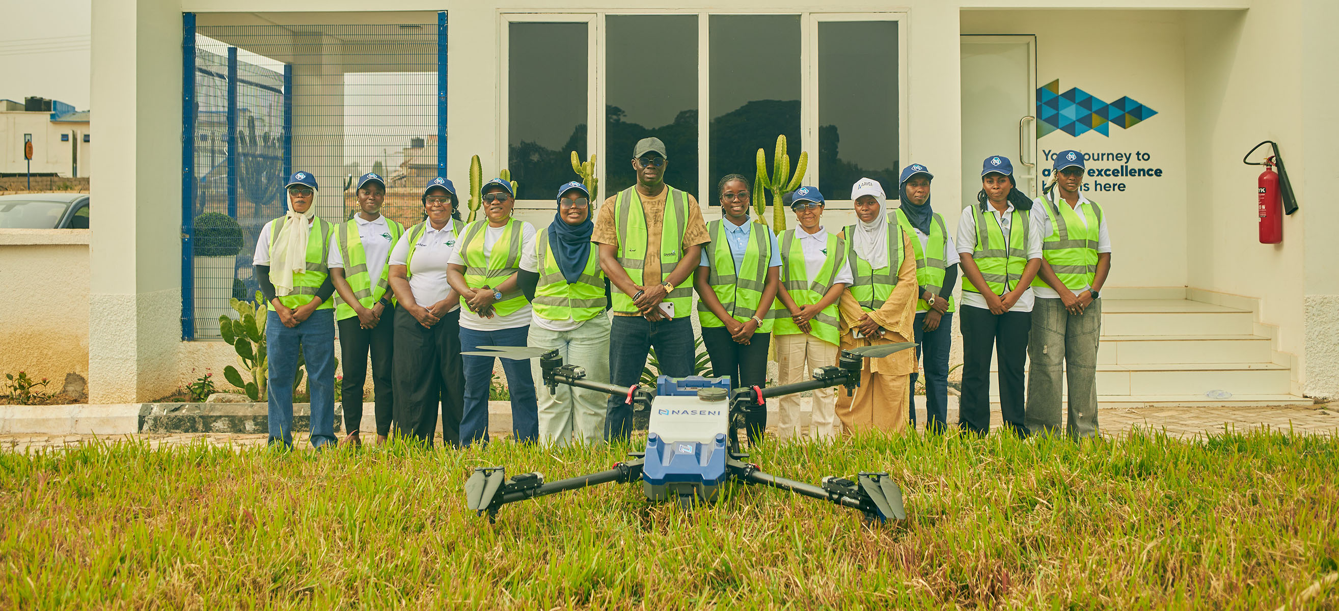 Female drone pilot trainees in outdoor field training session with UAVs